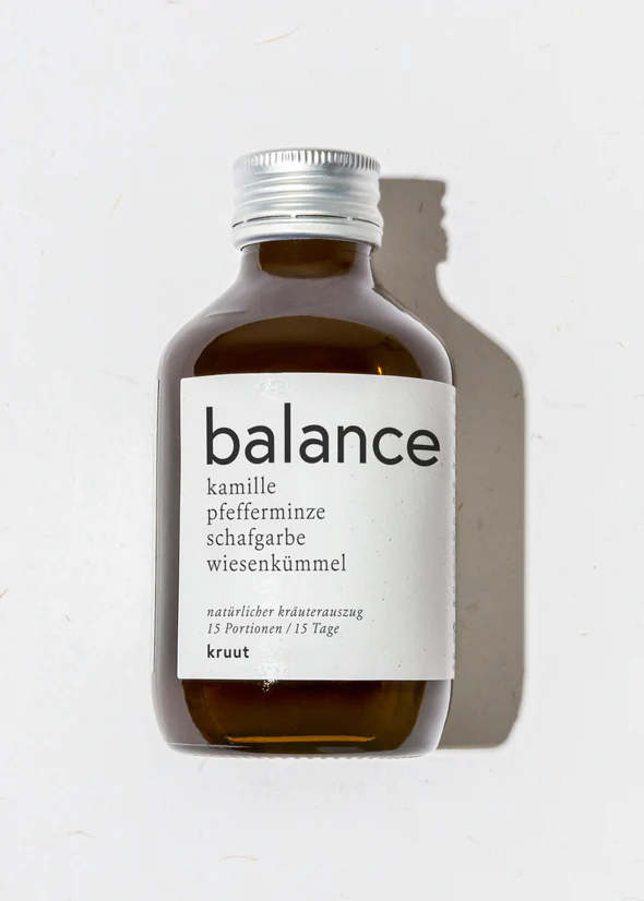 Bottle of herbal blend labeled "balance," containing chamomile, peppermint, sheep's sorrel, and caraway, designed for 15 servings over 15 days.