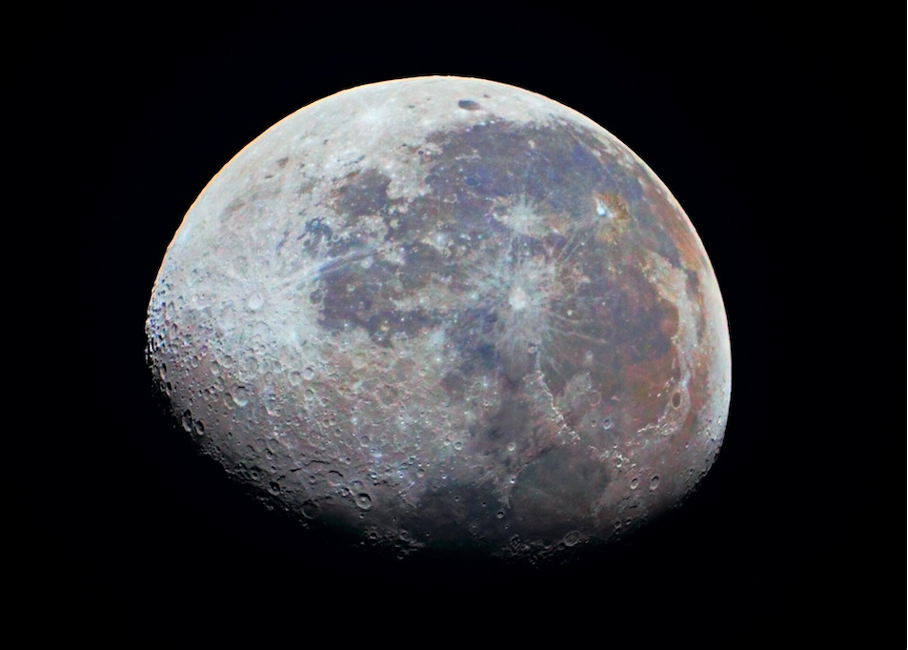 The image presents a stunning close-up view of the moon, showcasing its intricate details and textures. * The moon is depicted as a sphere with a cratered surface. + The craters vary in size, from small depressions to large impact basins. + Some craters appear to have central peaks or rings, indicating the presence of ejecta thrown out during the impact event. * A portion of the moon's shadow falls on its surface. + The shadow is visible as a dark area on the left side of the image. + It suggests that the sun is positioned behind the Earth, casting an indirect light on the moon. The image provides a unique perspective on the moon's geology and composition, highlighting the complex history of impacts and geological processes that have shaped its surface over billions of years.