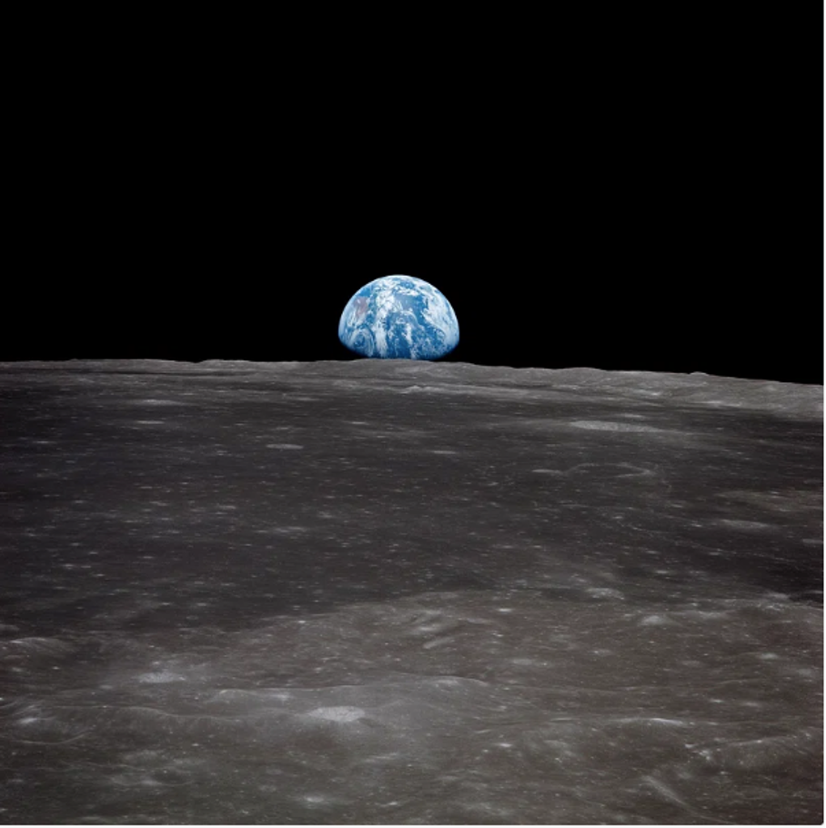 The image presents a breathtaking view of Earth from the surface of the moon, showcasing the planet's curvature and vibrant blue hue. **Key Features:** * **Earth:** The blue sphere dominates the upper half of the image, with its curvature visible against the blackness of space. * **Moon Surface:** The lower half of the image features a grayish-brown terrain, dotted with craters and rocks. * **Background:** The sky above the moon is pitch-black, providing a striking contrast to the illuminated Earth. **Atmosphere:** The overall atmosphere of the image is one of awe-inspiring beauty, highlighting humanity's unique perspective on our planet from space.