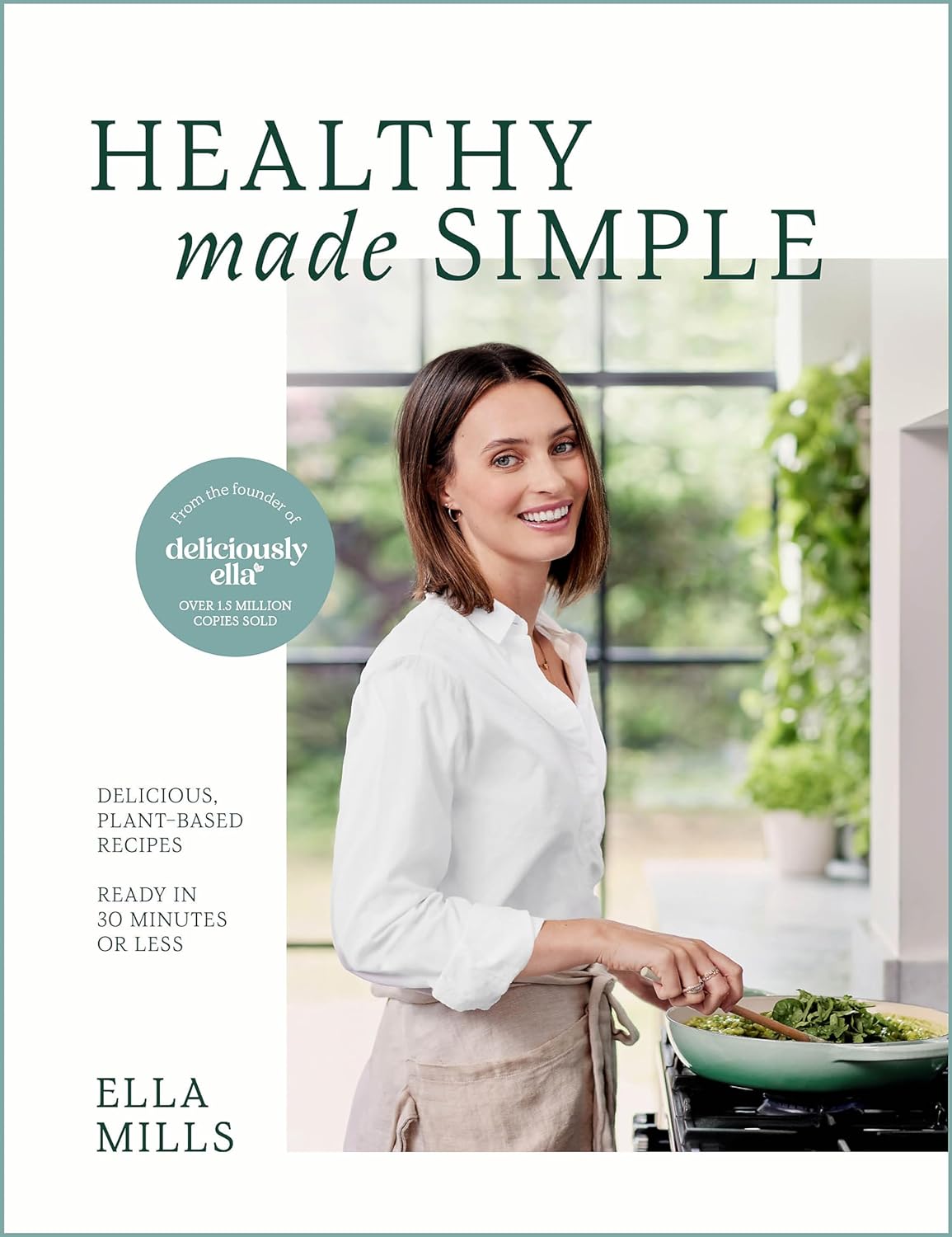 The image is a book cover for "HEALTHY made SIMPLE" by Ella Mills, featuring a woman cooking in a kitchen. * The title of the book is "HEALTHY made SIMPLE" + It is written in large green text at the top of the image + The word "SIMPLE" is underlined * The author's name is Ella Mills + It is written in small black text at the bottom left corner of the image * The book cover features a woman cooking in a kitchen + She has short brown hair and is wearing a white shirt and beige apron + She is standing in front of a stove, stirring something in a pan with a wooden spoon Overall, the image suggests that the book is about healthy eating and simple recipes. The use of green text for the title and the presence of a woman cooking in a kitchen imply that the book will focus on wholesome, natural ingredients and easy-to-follow instructions.